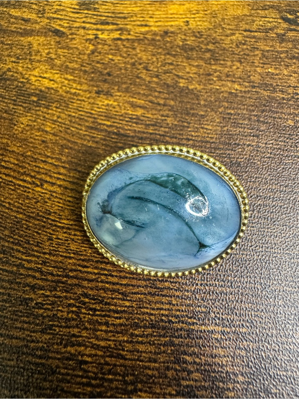 Antique Blue Marbled Oval Glass Brooch with Gold Trim Frame C Clasp